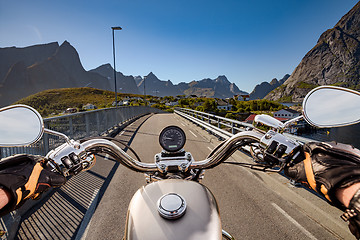 Image showing Biker rides on road in Norway. First-person view.