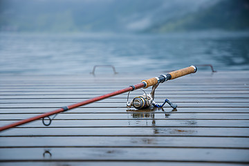 Image showing Fishing rod spinning blurred background