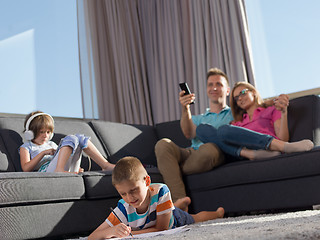 Image showing young happy couple spending time with kids