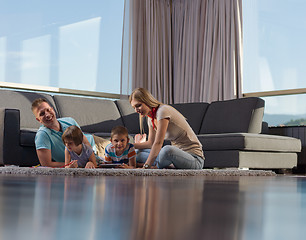 Image showing happy couple spending time with kids