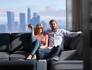 Image showing couple hugging on the sofa