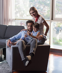 Image showing happy young couple spending time with kids