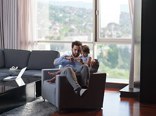 Image showing girl and her handsome father using a digital tablet