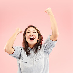 Image showing Winning success woman happy ecstatic celebrating being a winner. Dynamic energetic image of female model