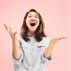 Image showing Beautiful woman looking suprised isolated on pink