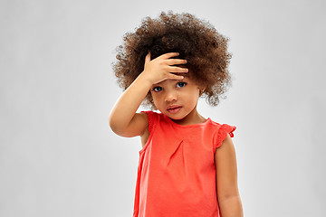 Image showing sad little african american girl touching forehead