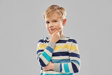 Image showing portrait of thinking boy in striped pullover