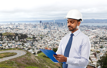 Image showing architect or businessman in helmet with clipboard