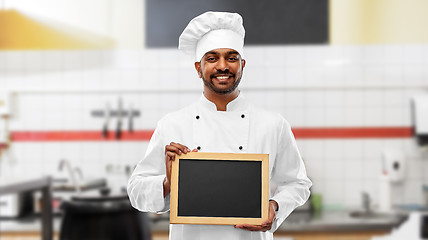 Image showing indian chef with chalkboard at restaurant kitchen