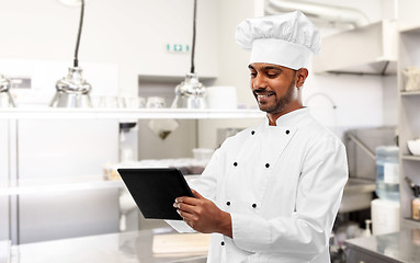 Image showing indian chef with tablet pc at restaurant kitchen