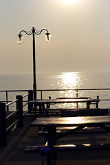 Image showing sunset over fishing village in greece