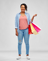 Image showing happy african american woman with shopping bags