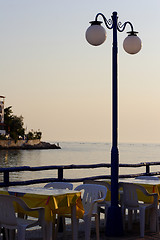 Image showing sunset over fishing village in greece