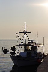 Image showing sunset over fishing village in greece