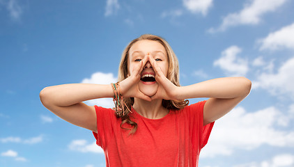 Image showing happy teenage girl in red t-shirt shouting