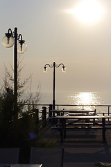 Image showing sunset over fishing village in greece