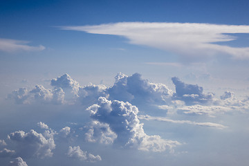 Image showing Big fluffy clouds on a blue sky background.