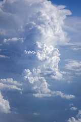 Image showing Big cumulus clouds lighted sunny beams.