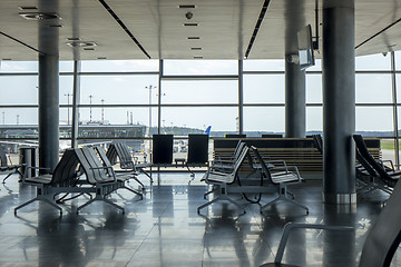 Image showing Contemporary airport hall interior with empty chairs.