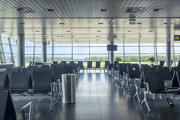 Image showing Modern airport waiting hall interior with empty chairs.