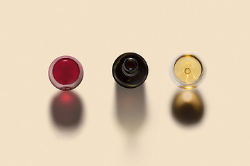 Image showing Drink set from bottle and two wine glasses with shadows.