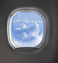 Image showing Aerial view of cloudy sky through airplaine window.