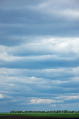 Image showing Farmland landscape on a background of cloudy sky.