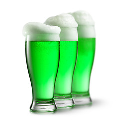 Image showing Green beer in glasses isolated on white background