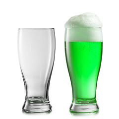 Image showing Empty and full glasses of green beer on a white background.