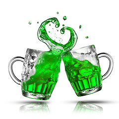 Image showing Two bouncing beer mugs with green drink splashes.