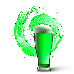 Image showing Glass of fresh green beer with splash on a white.