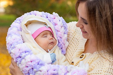 Image showing Mom rejoices in her two-month-old baby