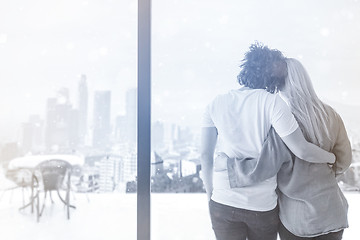 Image showing young couple enjoying morning coffee by the window