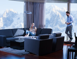 Image showing couple relaxing at  home with tablet computers