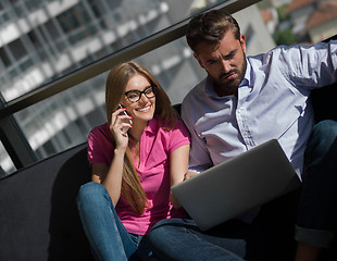 Image showing couple relaxing at  home using laptop computer