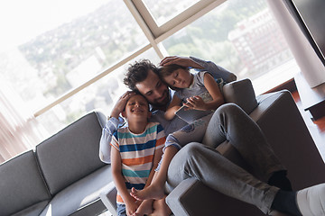 Image showing happy young father spending time with kids