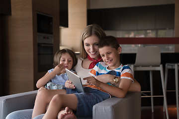 Image showing happy young mother spending time with kids