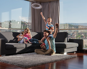 Image showing Happy family playing a video game