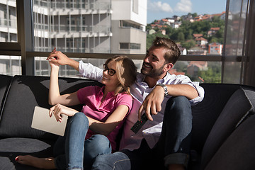 Image showing Young couple watching television