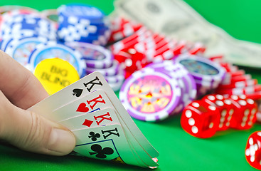 Image showing Card for poker in the hand, chips and card for poker