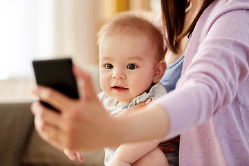 Image showing close up of mother with baby taking selfie