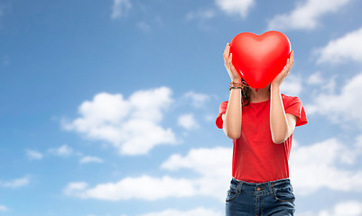 Image showing teenage girl with red heart shaped balloon