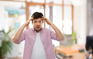 Image showing man touching his head over office room