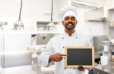 Image showing indian chef with chalkboard at restaurant kitchen