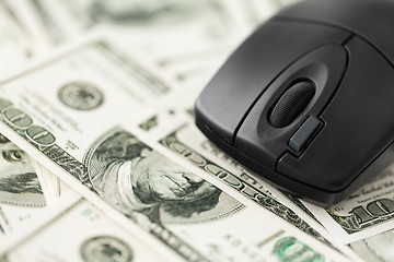 Image showing close up of computer mouse on us dollar money