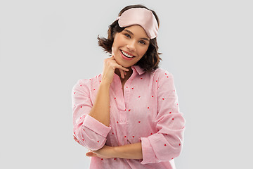 Image showing happy young woman in pajama and eye sleeping mask