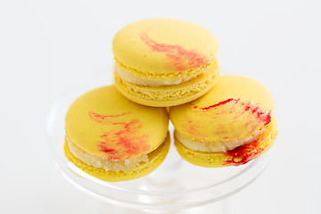 Image showing close up of yellow macarons on confectionery stand