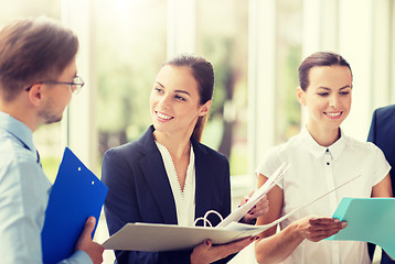 Image showing business team with folders meeting at office