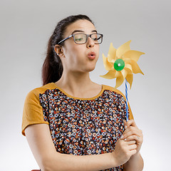 Image showing Blowing a windmill