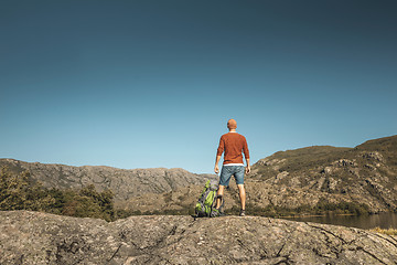 Image showing Man hiking near a beautiful lake